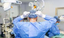 rear-view-of-male-surgeon-wearing-surgical-mask-in-operation-theater-at-hospital_657921-1145.jpg