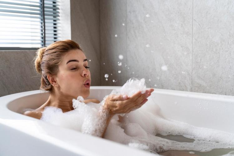 woman-enjoying-relaxing-bubble-bath_23-2149122079.jpg