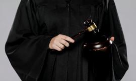 front-view-female-judge-with-gavel_23-2148453379.jpg