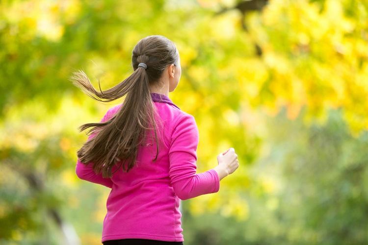 profile-portrait-of-a-young-attractive-woman-jogging-in-the-autu.jpg