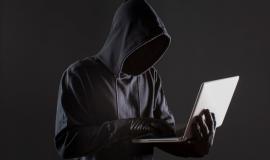 side-view-male-hacker-with-gloves-laptop_23-2148578161.jpg