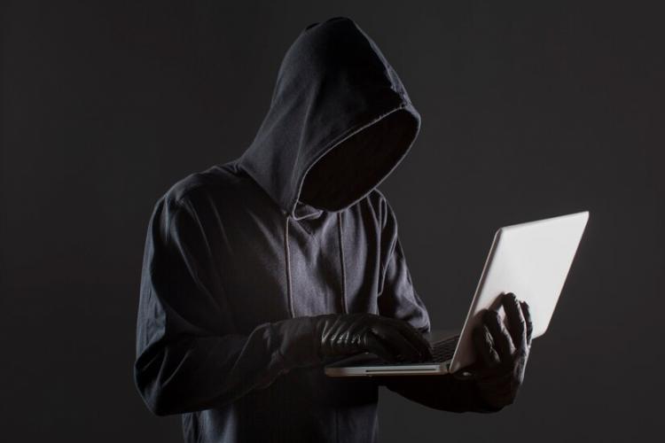 side-view-male-hacker-with-gloves-laptop_23-2148578161.jpg