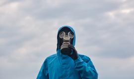 closeup-chemical-scientist-ecologist-posing-outdoor-dresses-blue-uniform-respirator-scientist-explores-surroundings-calls-protect-our-environmental-ecology-concept_176532-8754.jpg