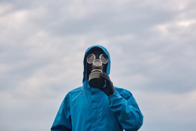 closeup-chemical-scientist-ecologist-posing-outdoor-dresses-blue-uniform-respirator-scientist-explores-surroundings-calls-protect-our-environmental-ecology-concept_176532-8754.jpg