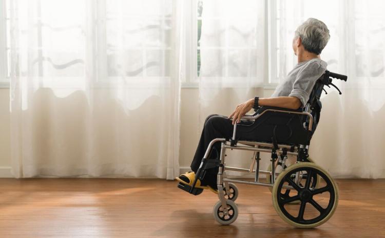 shot-senior-man-looking-out-window-while-sitting-wheelchair-homeelder-asian-male-stay-home-alone-wheelchair-look-view-out-window-from-living-room_609648-3146.jpg