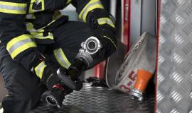 firefighter-with-safety-suit-at-the-station.jpg