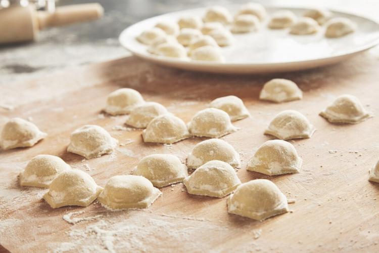 close-up-focus-ready-tasty-raviolis-dumplings-filled-with-minced-meat-flour-wooden-board_346278-1521.jpg