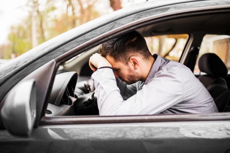 young-man-sitting-car-very-upset-stressed-after-hard-failure-moving-traffic-jam_231208-854.jpg