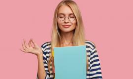 pleased-blonde-college-student-posing-against-pink-wall_273609-20742.jpg