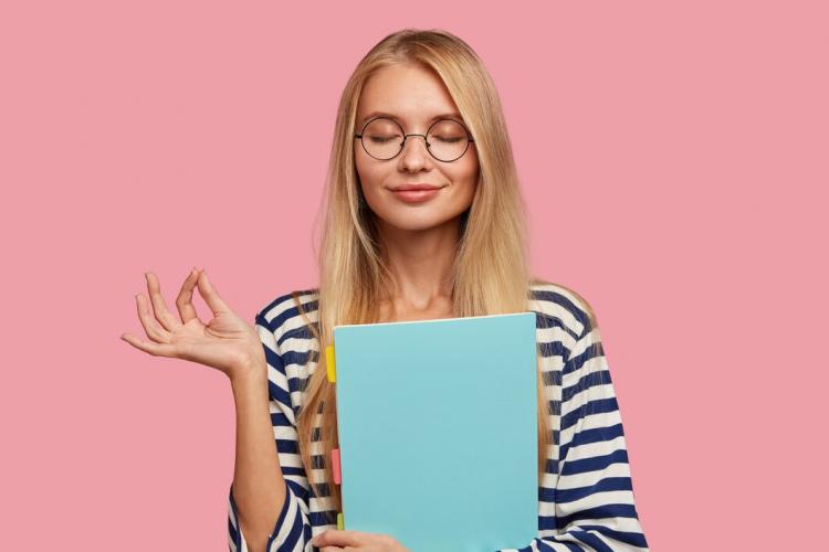 pleased-blonde-college-student-posing-against-pink-wall_273609-20742.jpg