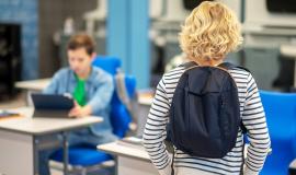 boy-standing-with-back-to-camera-in-classroom.jpg