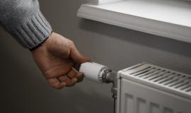 man-turning-off-radiator-during-energy-crisis.jpg