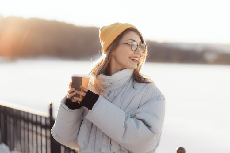 happy-young-teenage-woman-holding-takeaway-coffee-cup_158595-4986.jpg