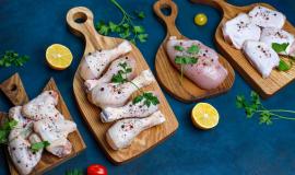 raw-chicken-meat-fillet-thigh-wings-legs-with-herbs-spices-lemon-garlic-dark-blue-background-top-view_2831-1071.jpg