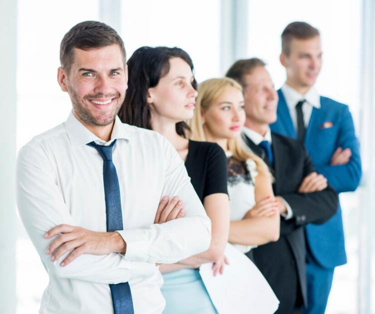 portrait-happy-manager-with-his-employees-standing-row_23-2147900116.jpg