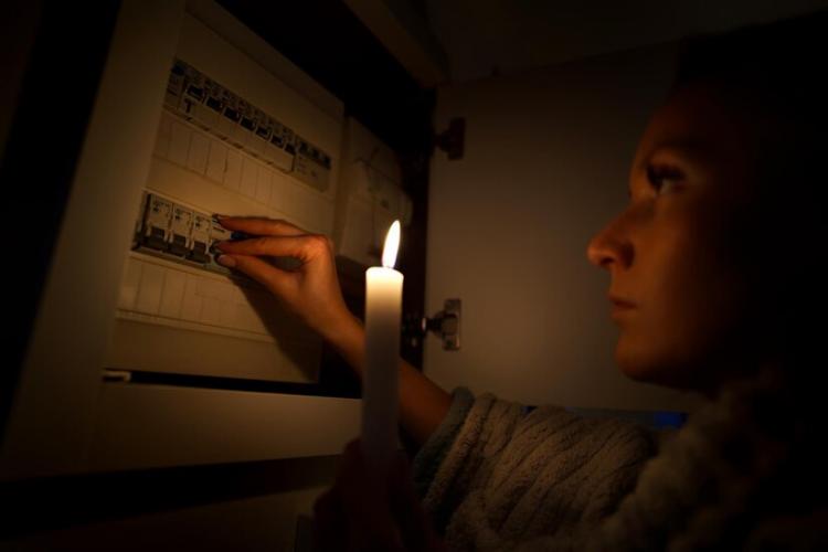 woman-total-darkness-investigating-fuse-box-during-power-outage-blackout-no-electricity_265657-417.jpg