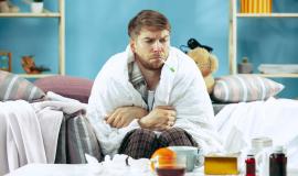 bearded-sick-man-with-flue-sitting-sofa-home-measuring-body-temperature-winter-illness-influenza-pain-concept-relaxation-home-healthcare-concepts_155003-31685.jpg