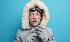 frozen-male-explorer-has-red-face-covered-with-frost-stares-very-shocked-surprised-by-very-low-temperature-wears-warm-jacket-gloves-has-walk-outdoor-during-blizzard-cold-weather_273609-47045.jpg