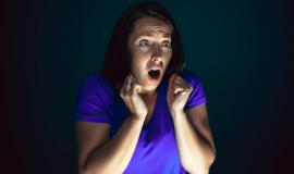 close-up-portrait-young-crazy-scared-shocked-woman-isolated-dark_155003-44015.jpg