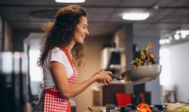 woman-chef-cooking-vegetables-pan_1303-22293.jpg