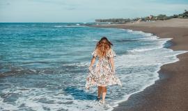 young-beautiful-girl-posing-on-the-beach-ocean-waves-bright-sun-and-tanned-skin.jpg