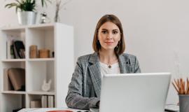 business-woman-checkered-jacket-with-smile-while-sitting-desk-her-office_197531-10661.jpg