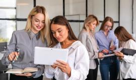 front-view-team-meeting-with-women-office_23-2148347193.jpg