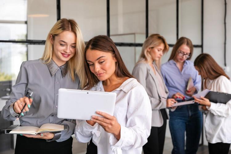 front-view-team-meeting-with-women-office_23-2148347193.jpg