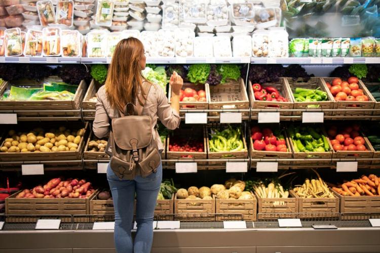 good-looking-woman-standing-front-vegetable-shelves-choosing-what-buy_342744-1117.jpg