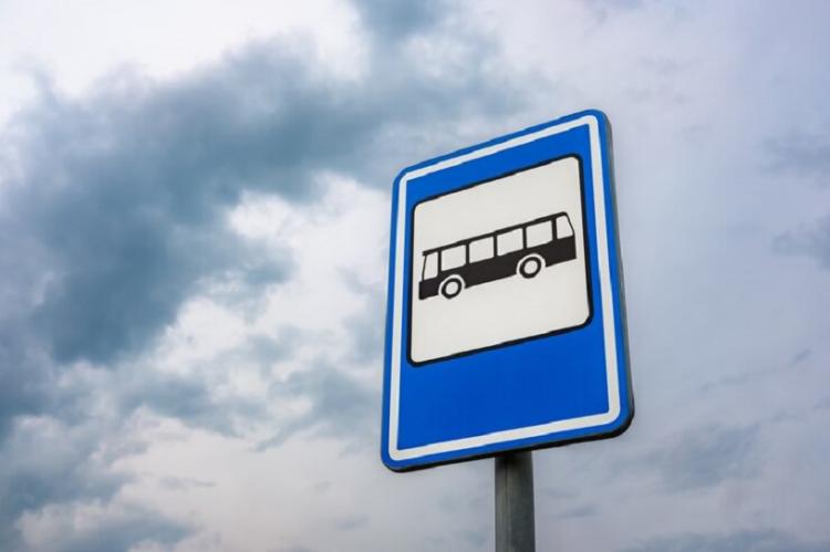 low-angle-shot-bus-stop-sign_181624-32465.jpg