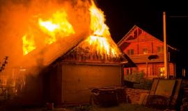 wooden-barn-burning-night-high-orange-fire-flames-dense-smoke-from-tiled-roof-dark-sky-trees-silhouettes-residential-wooden-neighbor-cottage-background-disaster-danger-concept_127089-4239.jpg