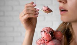 side-view-woman-eating-ice-cream_23-2149681902.jpg