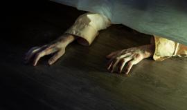 spooky-zombie-hands-bed_23-2149130247.jpg