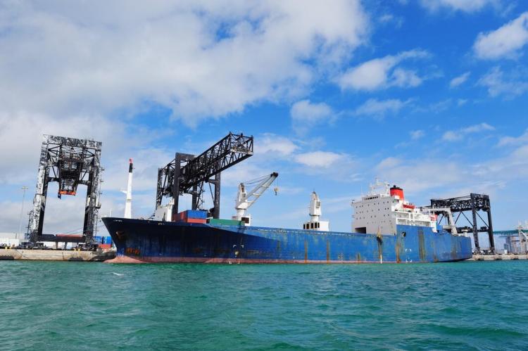 cargo-ship-miami-harbor-with-crane-blue-sky-sea_649448-1820.jpg