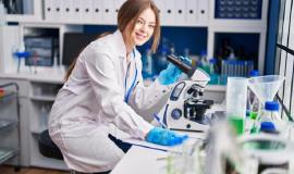 young-caucasian-woman-scientist-using-microscope-write-document-laboratory_839833-25659.jpg