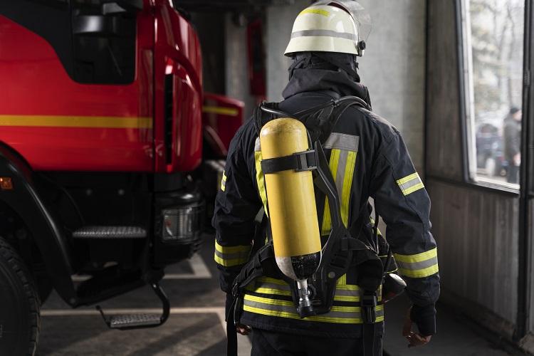 firefighter-at-the-station-with-suit-and-safety-helmet.jpg