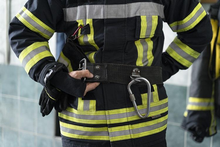 male-firefighter-getting-equipped-at-station.jpg