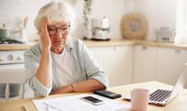 sad-frustrated-senior-woman-pensioner-having-depressed-look-holding-hand-her-face-calculating-family-budget-sitting-kitchen-counter-with-laptop-papers-coffee-calculator-cell-phone_344912-1570.jpg