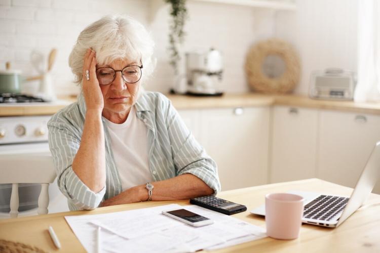 sad-frustrated-senior-woman-pensioner-having-depressed-look-holding-hand-her-face-calculating-family-budget-sitting-kitchen-counter-with-laptop-papers-coffee-calculator-cell-phone_344912-1570.jpg