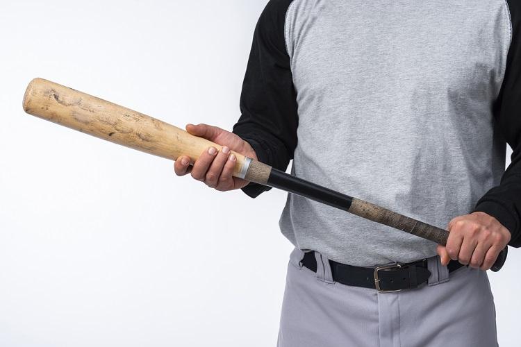 close-up-of-baseball-player-holding-bat.jpg