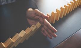 problem-solving-close-up-view-hand-business-woman-stopping-falling-blocks-table-concept-about-taking-responsibility_1418-55.jpg