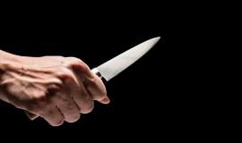 male-hand-holding-knife-on-black-background_35378-477-transformed.jpeg