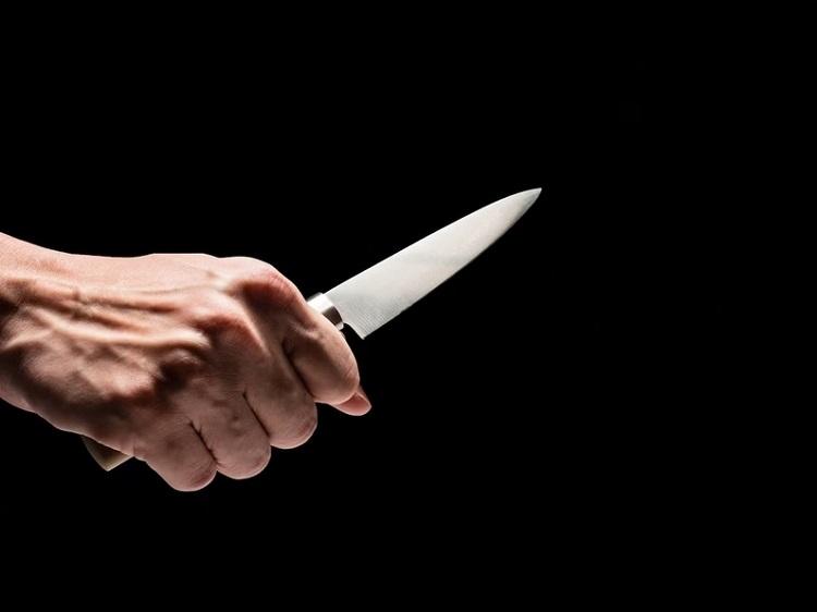 male-hand-holding-knife-on-black-background_35378-477-transformed.jpeg