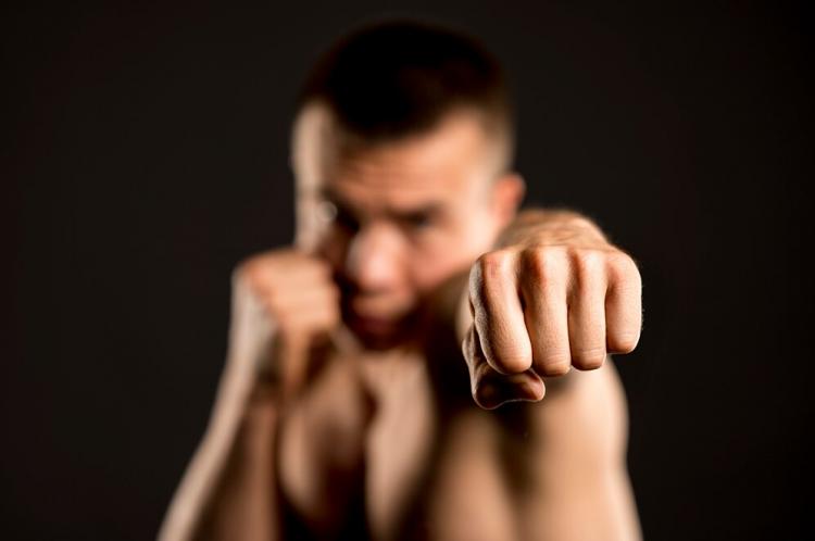 defocused-male-boxer-posing-with-boxing-stance_23-2148615013.jpg