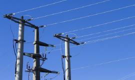 shot-electric-posts-lines-against-blue-background_181624-27509.jpg