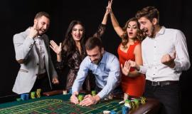 group-young-people-roulette-table-black-background-winning-player-bright-emotions_639032-684.jpg