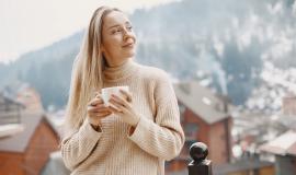 girl-in-a-warm-light-coat-vacation-in-mountains-lady-with-long-hair.jpg