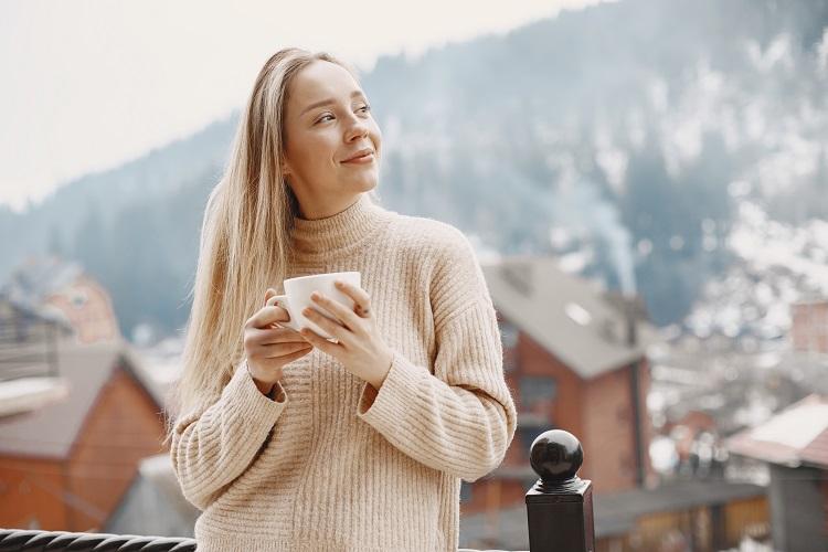 girl-in-a-warm-light-coat-vacation-in-mountains-lady-with-long-hair.jpg