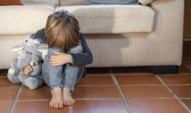 little-boy-outdoors-upset-holding-his-toy.jpg