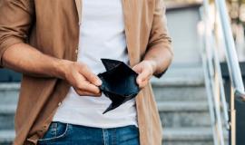 close-up-hands-holding-empty-wallet_23-2148773946.jpg
